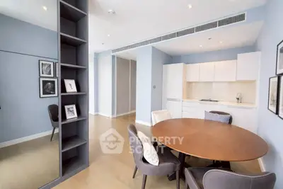 Modern open-plan living room with sleek kitchen and stylish dining area