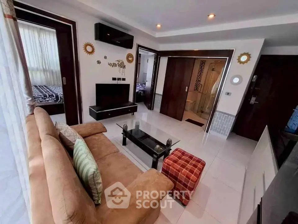 Modern living room with cozy sofa and stylish decor in a contemporary apartment.