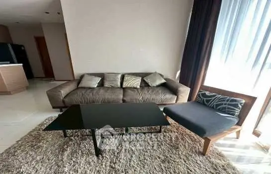 Modern living room with stylish sofa and coffee table in a bright apartment.