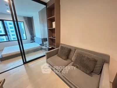 Modern apartment interior with cozy living room and stylish bedroom view.