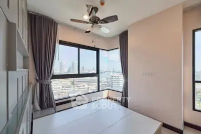 Modern bedroom with panoramic city view and ceiling fan