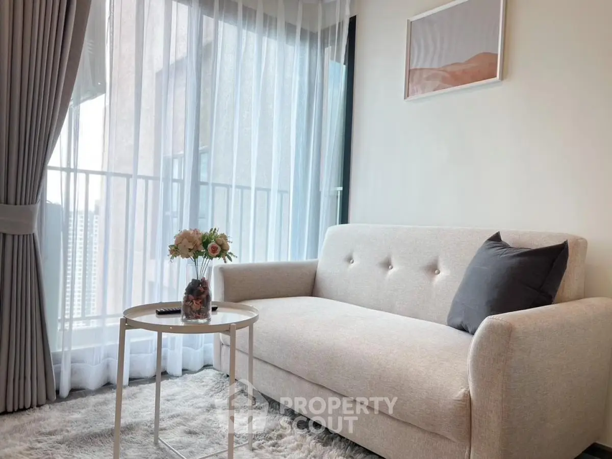 Chic modern living room with cozy sofa and balcony view