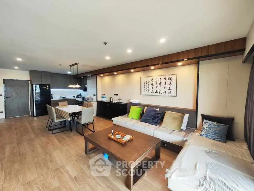 Spacious modern living room with open kitchen and stylish decor