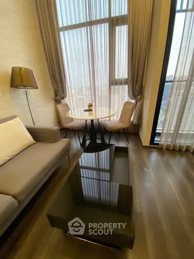 Luxurious high-rise living room with floor-to-ceiling windows and elegant decor