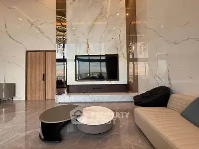 Luxurious modern living room with marble accents and sleek furniture