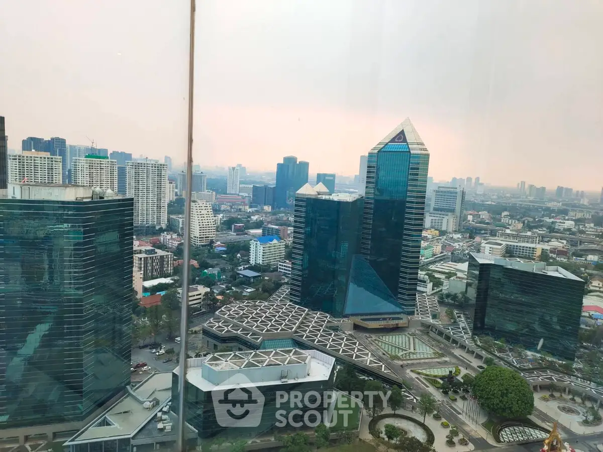 Stunning cityscape view from a high-rise building showcasing modern architecture and urban skyline.
