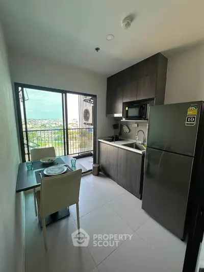 Modern kitchen with balcony view in a stylish apartment