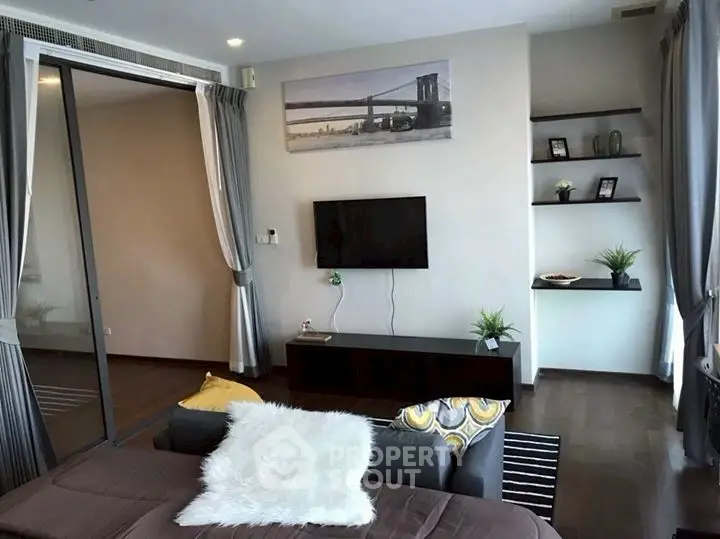 Modern living room with stylish decor and large windows for natural light.