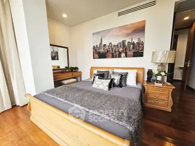 Luxurious bedroom with elegant wooden furniture and cityscape artwork, perfect for modern living.
