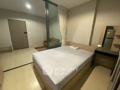 Modern bedroom with minimalist design and sliding glass door