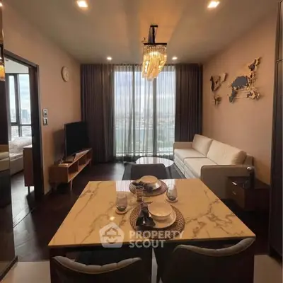 Luxurious living room with elegant dining area and stunning city view.