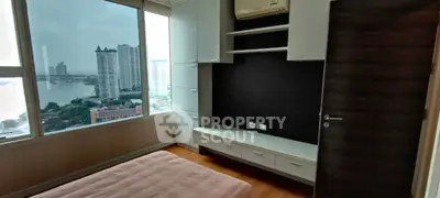 Modern bedroom with stunning city view and built-in storage