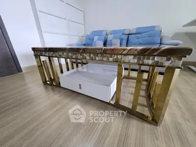 Modern living room with stylish coffee table and comfortable sofa