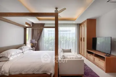 Luxurious bedroom with modern decor and large window offering natural light