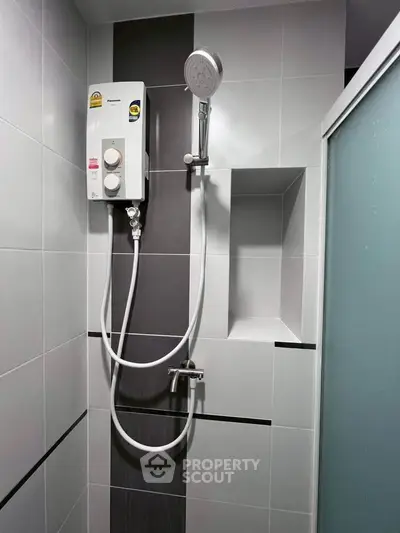 Modern bathroom with sleek shower unit and stylish tile design