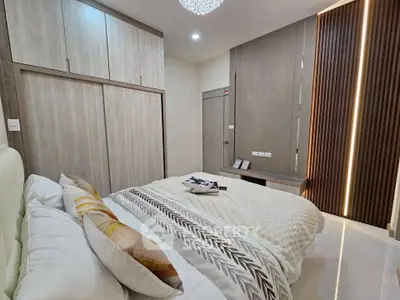 Modern bedroom with elegant decor and ample storage space