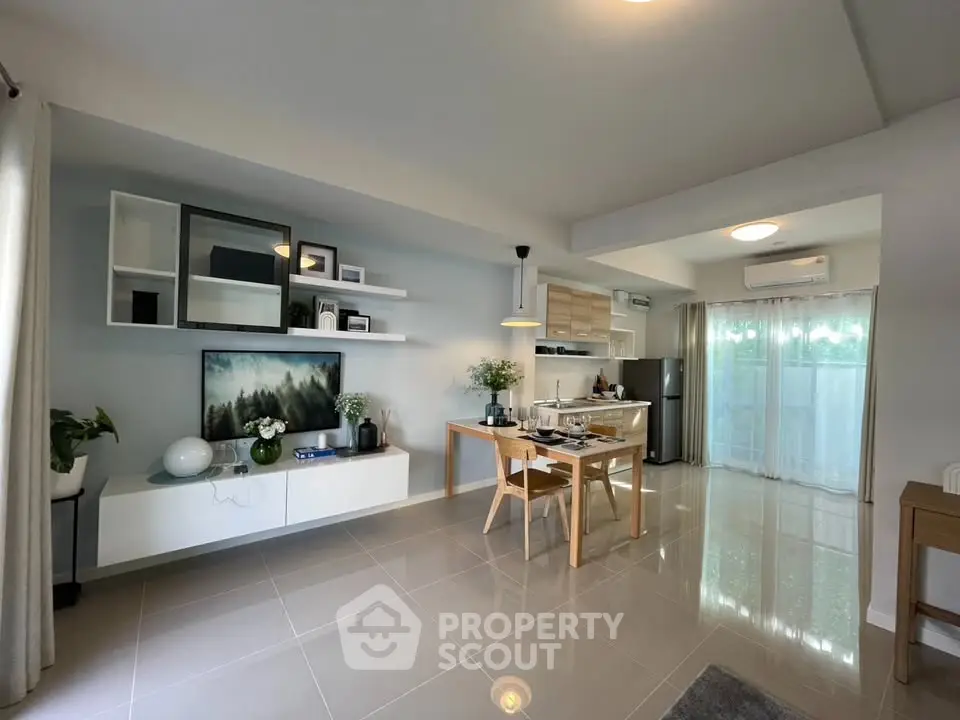 Modern open-plan living room with dining area and stylish decor