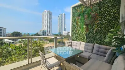 Stunning balcony with lush greenery and city view, perfect for relaxation.