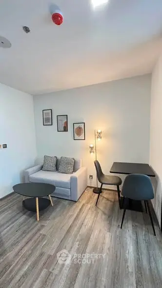 Modern living room with stylish furniture and elegant decor in a cozy apartment.