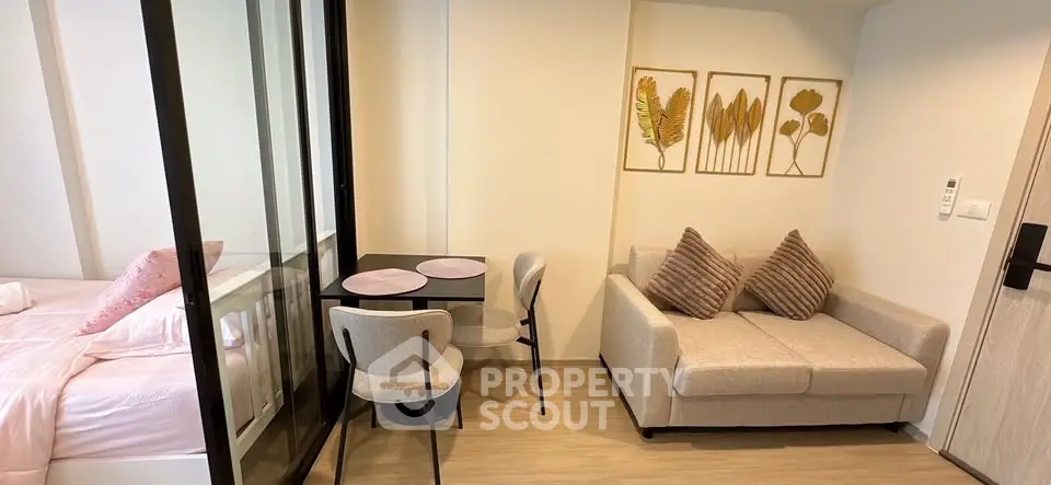 Modern studio apartment with cozy living area and stylish decor