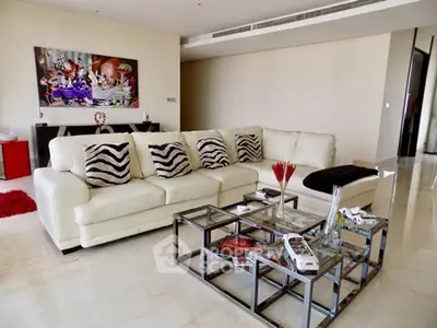 Luxurious living room with modern decor and plush white sofa