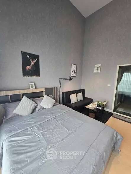 Modern bedroom with stylish decor and cozy seating area