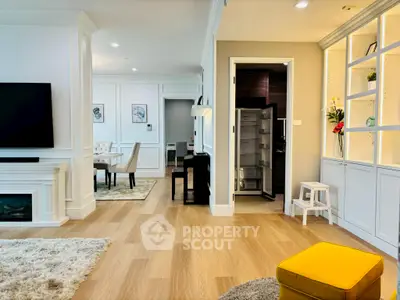 Elegant living room with open layout, featuring modern decor and stylish furnishings.