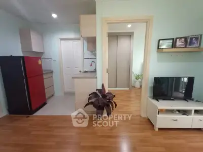 Charming open-plan living area with modern kitchen and cozy decor