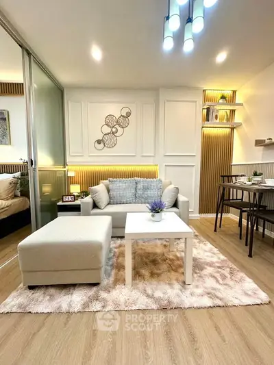 Modern living room with stylish decor and cozy seating area, perfect for relaxation and entertaining.