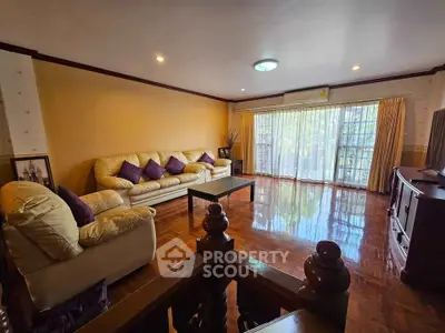 Spacious living room with elegant decor and large windows for natural light.