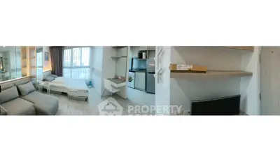 Modern studio apartment with cozy living area and compact kitchen
