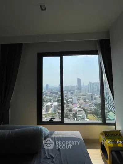 Stunning city view from a modern bedroom window, perfect for urban living.