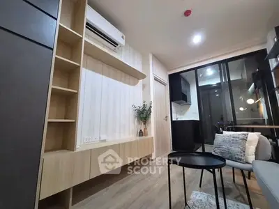 Modern living room with sleek furniture and air conditioning in a stylish apartment.