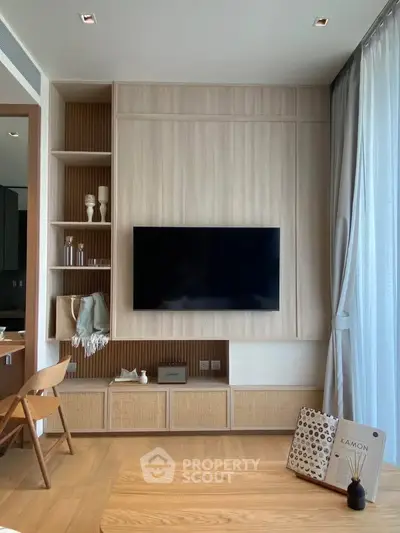 Modern living room with wall-mounted TV and stylish wooden decor