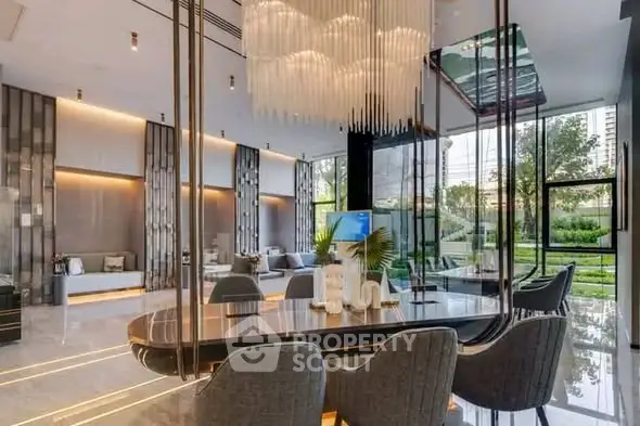 Luxurious modern living room with elegant chandelier and garden view, perfect for upscale living.