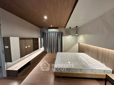 Modern bedroom with sleek wooden accents and ambient lighting