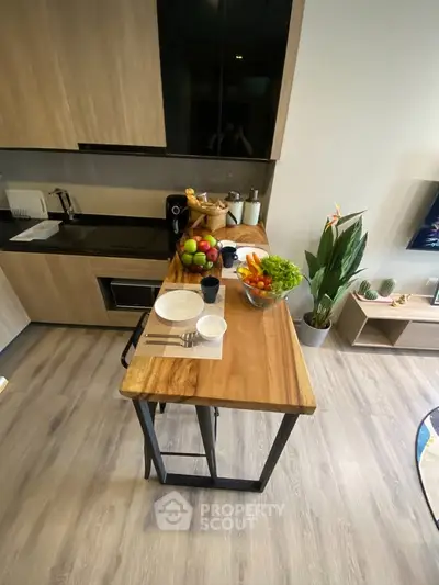 Modern kitchen with wooden countertop and fresh fruit display