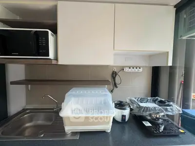 Modern kitchen with sleek appliances and ample storage space