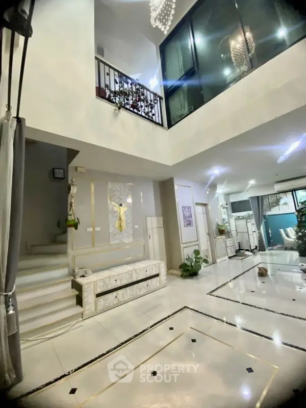 Stunning modern interior with high ceilings and elegant design, featuring open layout and luxurious finishes.