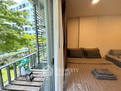 Cozy bedroom with balcony view in modern apartment
