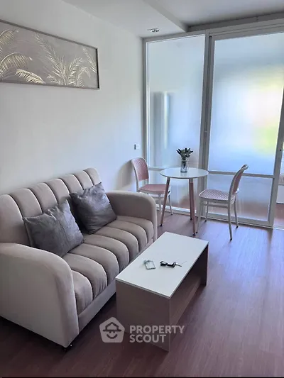 Chic modern living room with cozy sofa and stylish dining area, perfect for urban living.