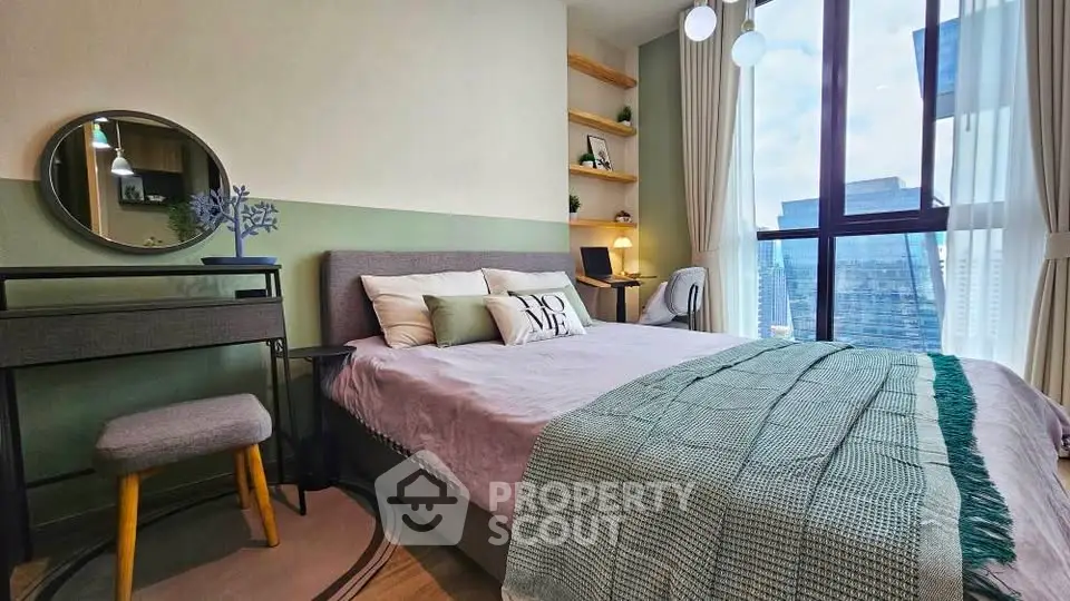 Modern bedroom with city view, featuring stylish decor and natural light.