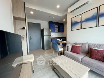 Modern living room with stylish furniture and open kitchen layout