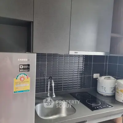 Modern kitchen with sleek cabinets and stainless steel appliances