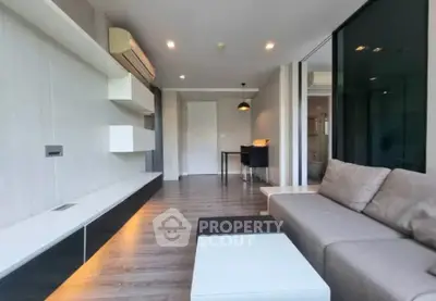 Modern living room with sleek design and air conditioning in a stylish apartment.