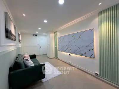 Stylish modern living room with elegant decor and cozy seating area.