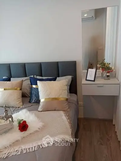 Cozy bedroom with elegant decor and plush bedding, perfect for relaxation.