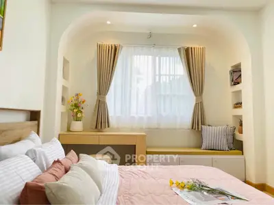 Charming bedroom with cozy window seat and elegant decor