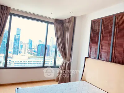 Spacious bedroom with stunning city view and elegant wooden accents