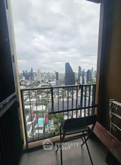 Stunning cityscape view from a high-rise balcony with modern urban skyline.